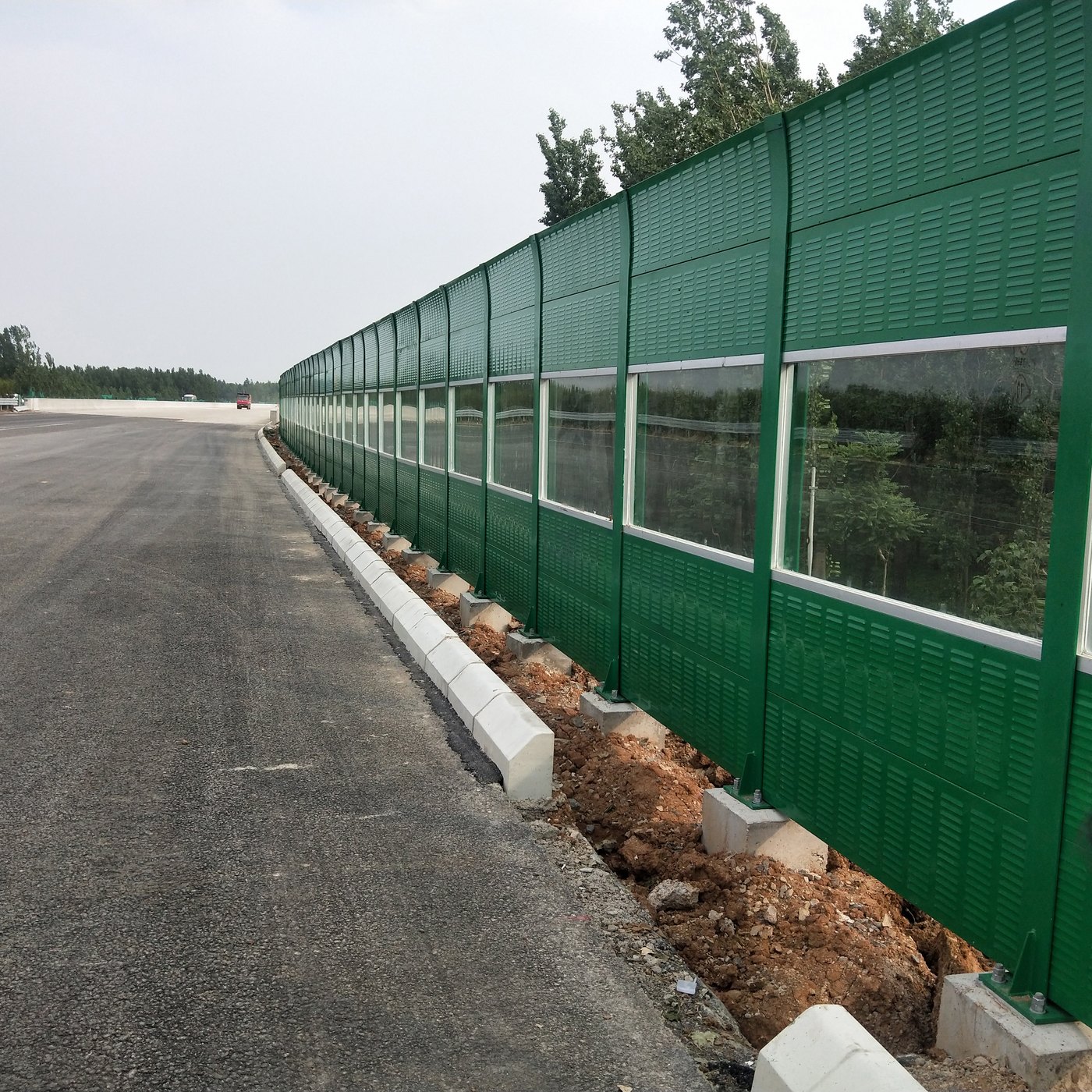 Polycarbonate Sheet for Sound Barriers and Noise Walls 1 Roadside sound barrier and noise wall project with transparent sheet panels