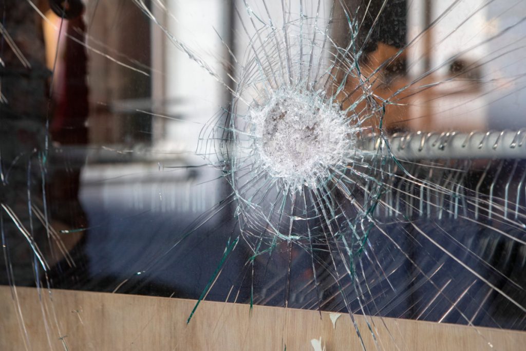 Polycarbonate Security Glazing and Protective Barriers 1 Impact-resistant security glazing panel with damaged outer glass layer